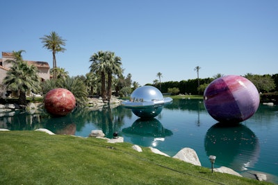 The event appropriately took on a space-inspired look, with cosmic photo ops and oversize planets floating in a lake. Guests like Barry Keoghan, Emma Roberts, and Charli D'Amelio enjoyed headlining performances from T-Pain, Two Friends, and DJ Xandra.