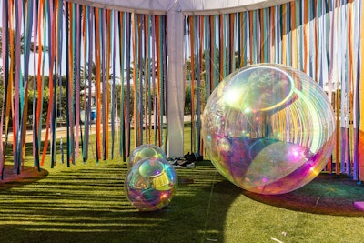 A larger-than-life art installation invited guests to step into a conceptual shower experience and capture memorable photos against the backdrop of the Indio mountains.